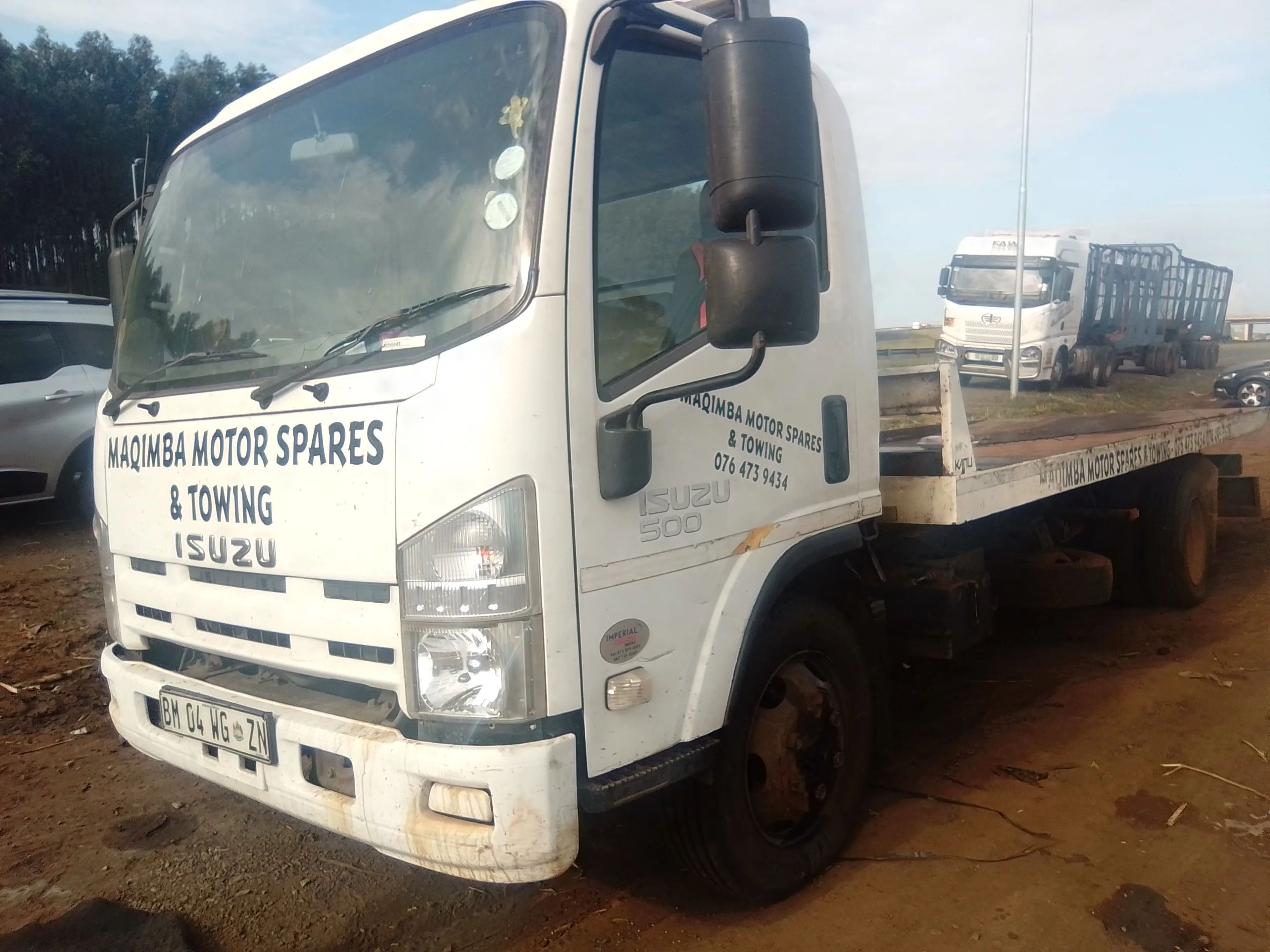 Maqimba Motor Spares & Towing — Isuzu 500 flatbed truck