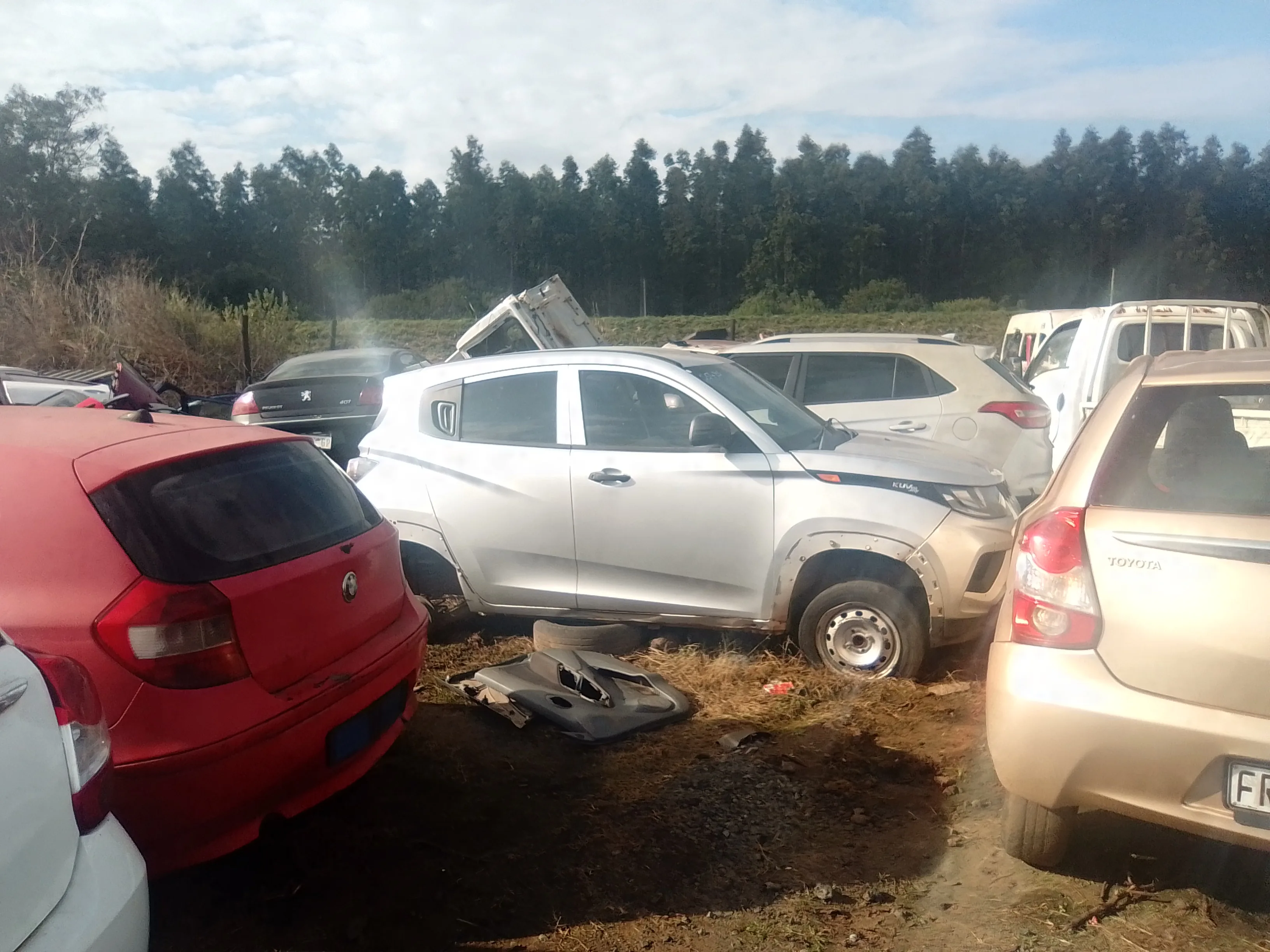 Maqimba Used Spares — close-up of stripped vehicles in yard