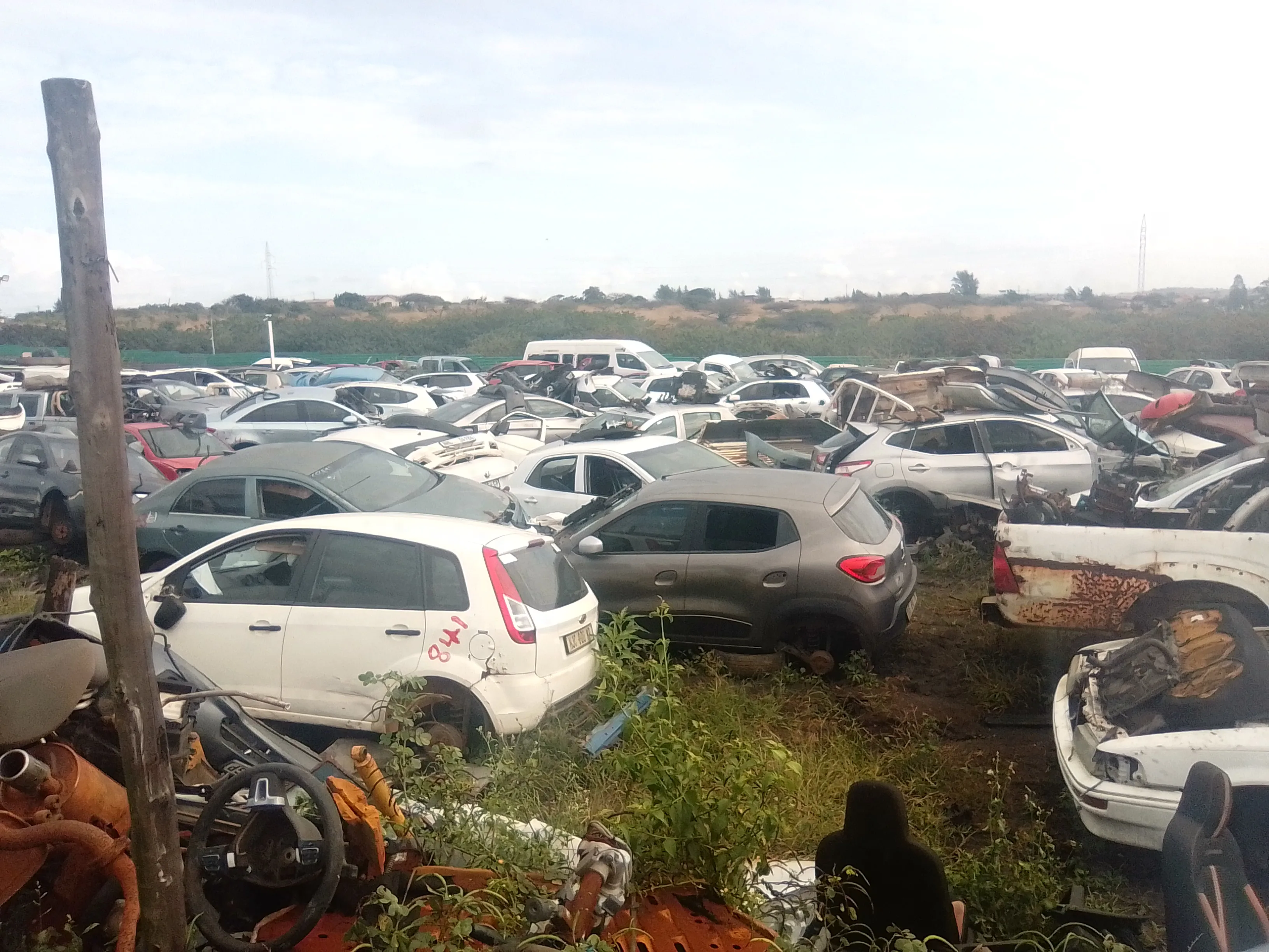 Maqimba Used Spares — full yard overview showing hundreds of stripped vehicles
